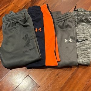 4 pairs of DriFit sweatpants. 3 Under Armour. 1Nike